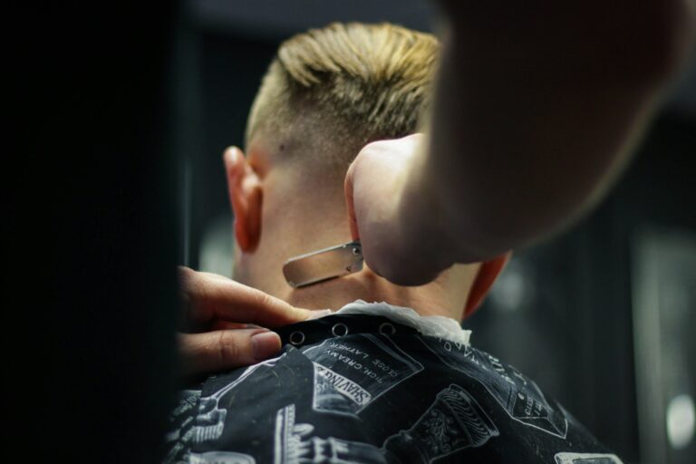 A guy getting a great haircut at his barbershop